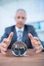 Businessman forecasting a crystal ball