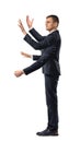 A businessman with four hands making grabbing motions and a fist in side view on white background.