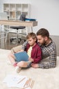Businessman freelancer reading book with son Royalty Free Stock Photo