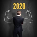 Businessman in front of a blackboard with 2020 written on it Royalty Free Stock Photo