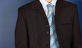 Businessman front of blue background