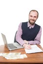 Businessman in front of his desk and laptop Royalty Free Stock Photo