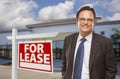 Businessman In Front of Office Building and For Lease Sign Royalty Free Stock Photo