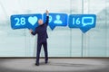 Businessman in front of a wall with a Like, Follower and message