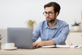 Businessman Frowning Working On Laptop Having Difficult Task At Workplace Royalty Free Stock Photo