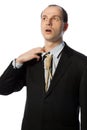 Businessman with gallow tie taking a breath