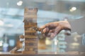 businessman gambling placing wooden block on a tower double expo