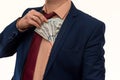 Businessman gets bribed and hides dollars in jacket pocket. Men`s hands hold money, illegal wealth. Corruption