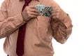 Businessman gets bribed and hides dollars in jacket pocket. Men`s hands hold money, illegal wealth. Corruption
