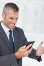 Businessman getting angry after a phone call Royalty Free Stock Photo
