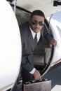 Businessman Getting Down From Airplane Royalty Free Stock Photo