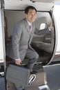 Businessman Getting Down From Private Airplane Royalty Free Stock Photo
