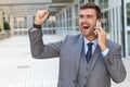 Businessman getting phenomenal news on the phone Royalty Free Stock Photo