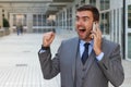 Businessman getting phenomenal news on the phone Royalty Free Stock Photo