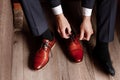 Businessman getting ready for work. Putting his shoes on. man puts on his brown shoes Royalty Free Stock Photo