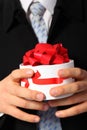 Businessman with gift box in hands Royalty Free Stock Photo