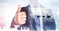 Businessman give a thumb up, double exposure with office interior Royalty Free Stock Photo
