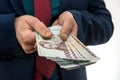 Businessman gives bribe or pay, in isolation. UAH. 1000 new banknote Ukrainian money