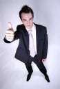 Businessman gives thumbs up Royalty Free Stock Photo