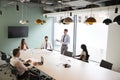 Businessman Giving Boardroom Presentation To Colleagues In Meeting Room Royalty Free Stock Photo