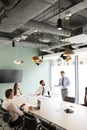 Businessman Giving Boardroom Presentation To Colleagues In Meeting Room Royalty Free Stock Photo