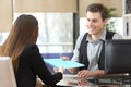 Businessman giving documents to a client at office