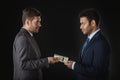 Businessman giving money and bribing business partner