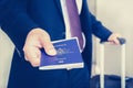 Businessman giving passport with boarding pass inside Royalty Free Stock Photo