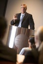 Businessman giving presentation at podium Royalty Free Stock Photo