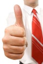 Businessman giving thumbs up