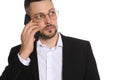 Businessman in glasses talking on smartphone against white background Royalty Free Stock Photo