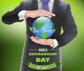 Businessman with a globe of concept world environment day Royalty Free Stock Photo