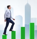 Businessman going up the bar chart in growth concept Royalty Free Stock Photo