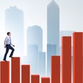 Businessman going up the bar chart in growth concept Royalty Free Stock Photo
