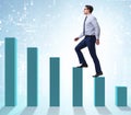 Businessman going up the bar chart in growth concept Royalty Free Stock Photo