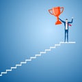 Businessman going up to trophy and success. Stair step to success