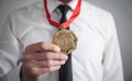 Businessman with gold medal. Medal awards for winner