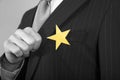 Businessman With Gold Star On Suit