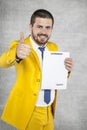 Businessman in a gold suit showing thumbs up, the new agreement Royalty Free Stock Photo