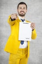 Businessman in a gold suit shows on you, the new agreement Royalty Free Stock Photo