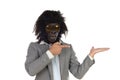 Businessman with gorilla head gesturing