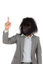 Businessman with gorilla head gesturing