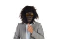 Businessman with gorilla head gesturing