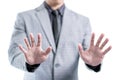 Businessman in gray suit is showing his two hands to stop something