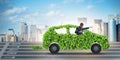 The businessman in green electric car concept Royalty Free Stock Photo