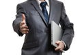 Businessman in grey suit holding laptop in one arm Royalty Free Stock Photo