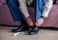 Businessman or groom wears shoes Royalty Free Stock Photo