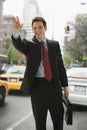 Businessman Hailing a Taxi