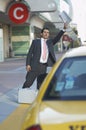 Businessman Hailing Taxi