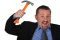 Businessman with a hammer Royalty Free Stock Photo